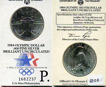 США 1 доллар 1984 XXII Олимпийские игры в Лос-Анжелесе, стадион, P в оригинальном буклете KM 210 серебро UNC 00-00